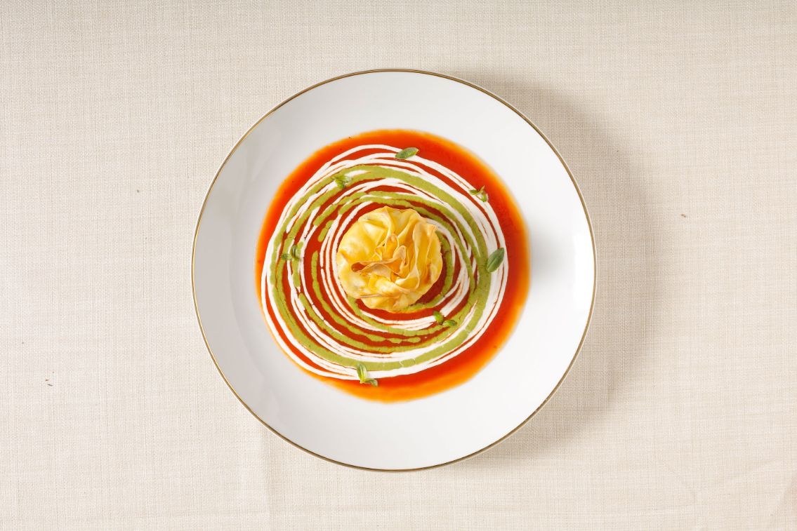 fagottini-al-ragu-di-pesce-su-letto-di-burrata--pomodoro-e-basil-image